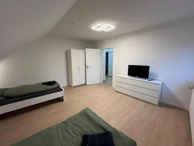 Ein Bett oder Betten in einem Zimmer der Unterkunft HörnQuartier - modern eingerichtete Ferienwohnung - Familienfreundlich, ideal auch für Geschäftskunden
