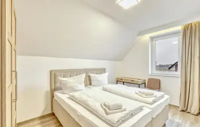 Ein Bett oder Betten in einem Zimmer der Unterkunft Lovely Home In Wurster Nordseeküste With Sauna