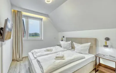 Ein Bett oder Betten in einem Zimmer der Unterkunft Lovely Home In Wurster Nordseeküste With Sauna
