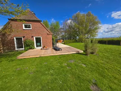 Ein Garten an der Unterkunft Ferienhaus DeichKate