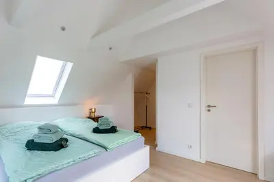 Ein Bett oder Betten in einem Zimmer der Unterkunft Ferienhaus DeichKate