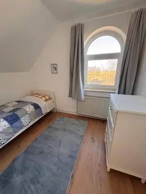 Ein Bett oder Betten in einem Zimmer der Unterkunft Gut Ellernwurth Wremen