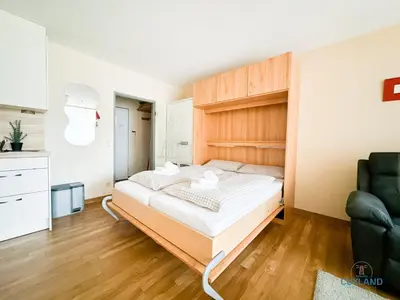 Ein Bett oder Betten in einem Zimmer der Unterkunft Haus Trafalgar Wohnung 130