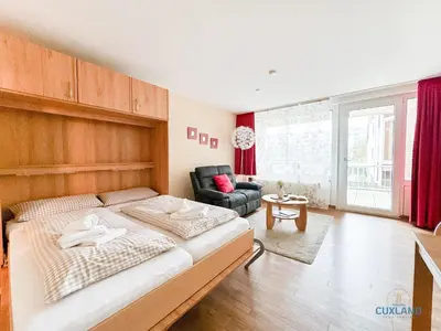 Ein Bett oder Betten in einem Zimmer der Unterkunft Haus Trafalgar Wohnung 130