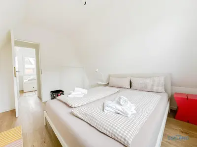 Ein Bett oder Betten in einem Zimmer der Unterkunft Ferienhaus am Ringwall 19