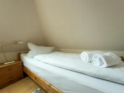 Ein Bett oder Betten in einem Zimmer der Unterkunft Land & Meer Wohnung 22