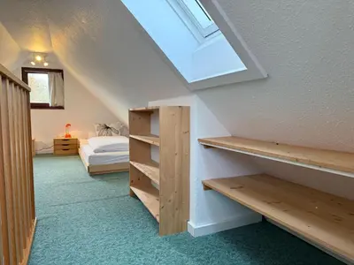 Ein Bett oder Betten in einem Zimmer der Unterkunft Haus Muschelnest