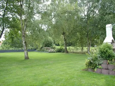 Ein Garten an der Unterkunft Holiday Home mit Indoorpool- Garten und Partyraum by Interhome