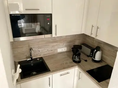 Küche/Küchenzeile in der Unterkunft Apartment Nordseedüne II by Interhome