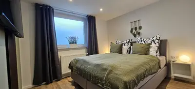 Ein Bett oder Betten in einem Zimmer der Unterkunft haven-apartments Duhnen