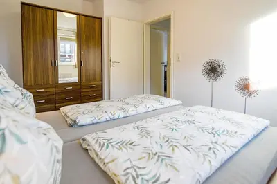 Ein Bett oder Betten in einem Zimmer der Unterkunft Haus am Waldbad AW05