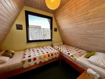 Ein Bett oder Betten in einem Zimmer der Unterkunft Ringwall 45 Ferienhaus Lu & Le