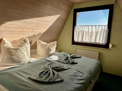 Ein Bett oder Betten in einem Zimmer der Unterkunft Ringwall 45 Ferienhaus Lu & Le