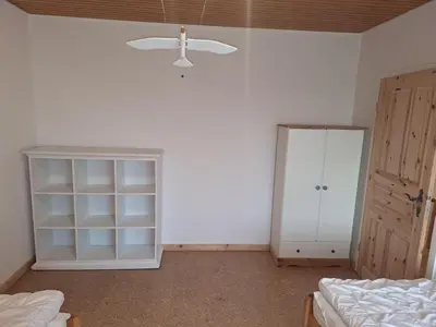 Ein Bett oder Betten in einem Zimmer der Unterkunft Deichkieker