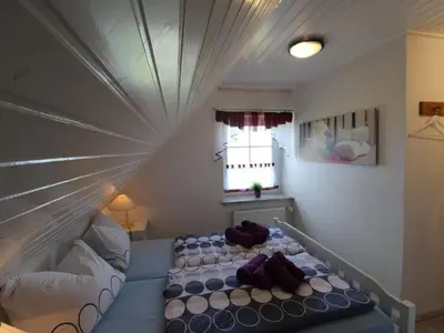 Ein Bett oder Betten in einem Zimmer der Unterkunft Apartment FeWo Herzmuschel by Interhome