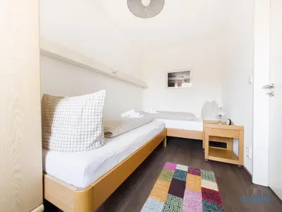 Ein Bett oder Betten in einem Zimmer der Unterkunft Ferienwohnung 19 Heinrich-Grube Weg