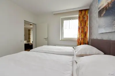 Ein Bett oder Betten in einem Zimmer der Unterkunft Hanseatic FeWo 812