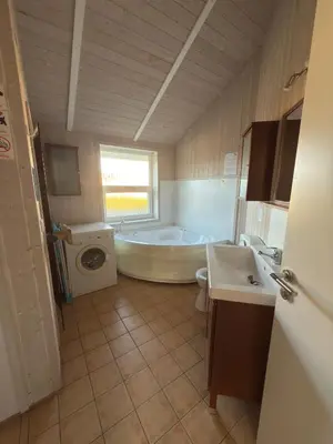 Ein Bett oder Betten in einem Zimmer der Unterkunft Fjordhaus am See - 6 Schlafzimmer, Seeblick, Sauna und Whirlpool