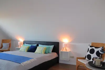 Ein Bett oder Betten in einem Zimmer der Unterkunft Ferienhaus Perlmuschel