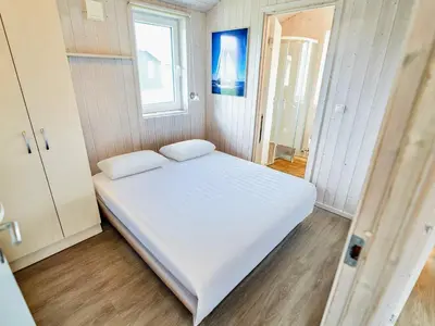 Ein Bett oder Betten in einem Zimmer der Unterkunft Holiday Home near North Sea Dike