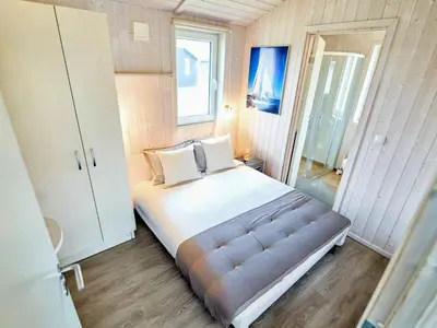 Ein Bett oder Betten in einem Zimmer der Unterkunft Holiday Home near North Sea Dike