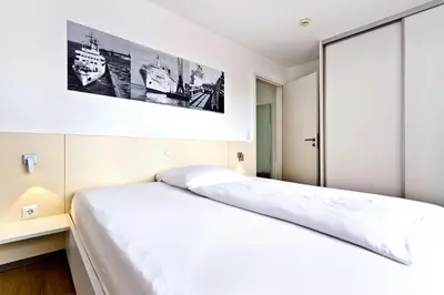Ein Bett oder Betten in einem Zimmer der Unterkunft Alte Liebe, RA108