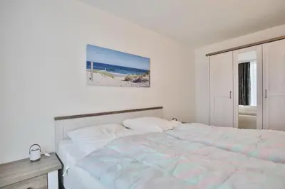 Ein Bett oder Betten in einem Zimmer der Unterkunft Hohe Worth, H6