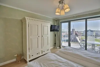 Ein Bett oder Betten in einem Zimmer der Unterkunft Residenz am Yachthafen, RY28