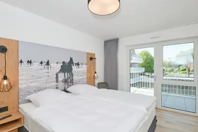 Ein Bett oder Betten in einem Zimmer der Unterkunft Nordstrand, N201