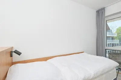 Ein Bett oder Betten in einem Zimmer der Unterkunft Nordstrand, N201