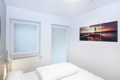 Ein Bett oder Betten in einem Zimmer der Unterkunft Duhner Brandung, B2