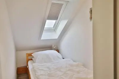 Ein Bett oder Betten in einem Zimmer der Unterkunft Hohe Worth, H406