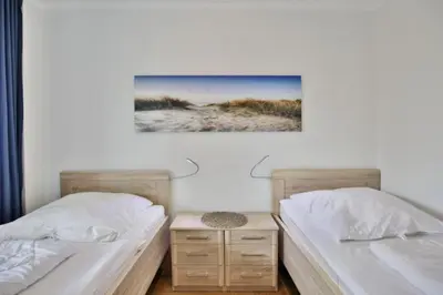 Ein Bett oder Betten in einem Zimmer der Unterkunft Hohe Worth, H206