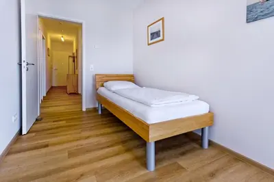 Ein Bett oder Betten in einem Zimmer der Unterkunft Residenz am Yachthafen, RY29