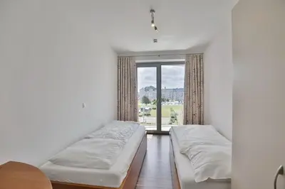 Ein Bett oder Betten in einem Zimmer der Unterkunft Residenz am Yachthafen, RY22