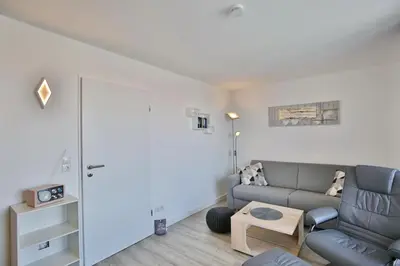 Ein Sitzbereich in der Unterkunft Hohe Worth, H409