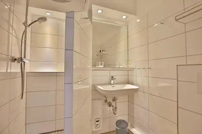 Ein Badezimmer in der Unterkunft Hohe Worth, H409