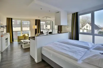 Ein Bett oder Betten in einem Zimmer der Unterkunft Duhner Strandhus, S102