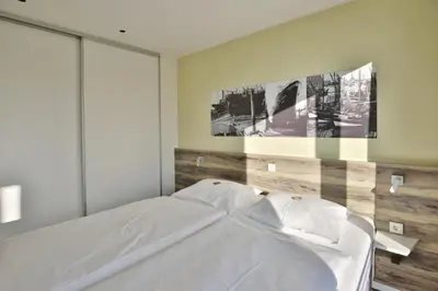 Ein Bett oder Betten in einem Zimmer der Unterkunft Duhner Strandhus, S114