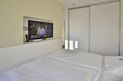 Ein Bett oder Betten in einem Zimmer der Unterkunft Duhner Strandhus, S114