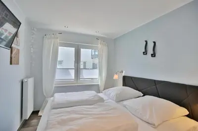 Ein Bett oder Betten in einem Zimmer der Unterkunft Admiralsgarten, AG5b