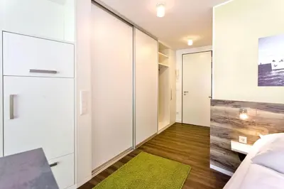 Ein Bett oder Betten in einem Zimmer der Unterkunft Duhner Strandhus, S12