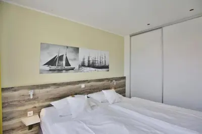 Ein Bett oder Betten in einem Zimmer der Unterkunft Duhner Strandhus, S203