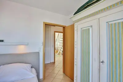 Ein Bett oder Betten in einem Zimmer der Unterkunft Duhner Brise, DB6