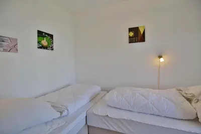 Ein Bett oder Betten in einem Zimmer der Unterkunft Hohe Worth, H111