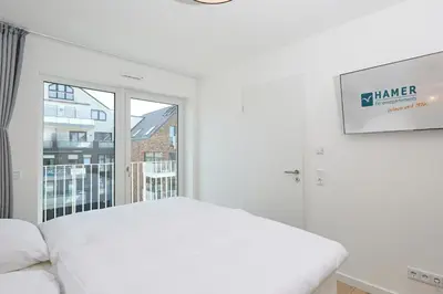 Ein Bett oder Betten in einem Zimmer der Unterkunft Nordstrand, N304