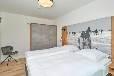 Ein Bett oder Betten in einem Zimmer der Unterkunft Nordstrand, N304