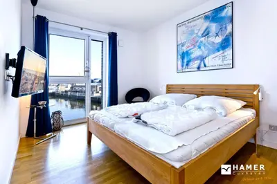 Ein Bett oder Betten in einem Zimmer der Unterkunft Haus Yachthafen, KY6