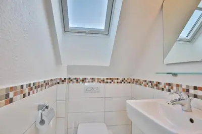 Ein Badezimmer in der Unterkunft Wattwagen, RW4