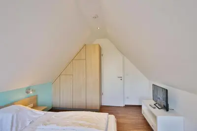 Ein Bett oder Betten in einem Zimmer der Unterkunft Wattwagen, RW4